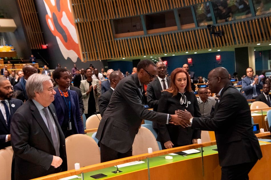 Paul Kagame and Fr. Marcel Uwineza greet each other at the UN.