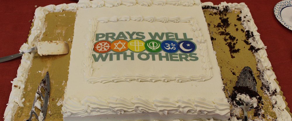 Sheet cake that says "Prays Well With Others"