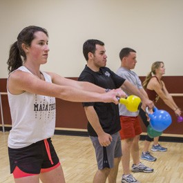 Student doing kettle ball exercises at the BC Plex