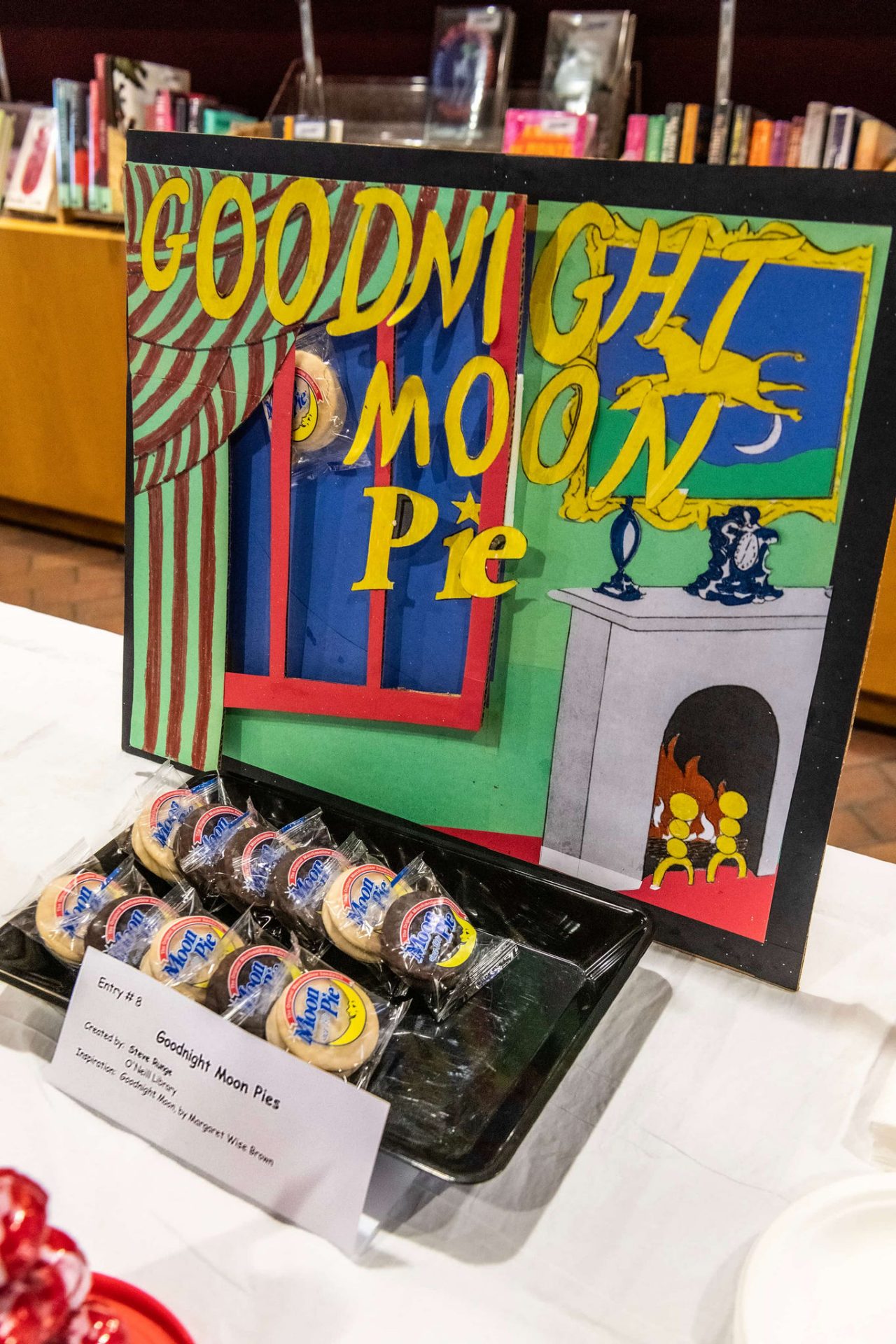 A takeoff on the cover of "Goodnight Moon," changed to "Goodnight Moon Pies" with moon pie cakes next to it