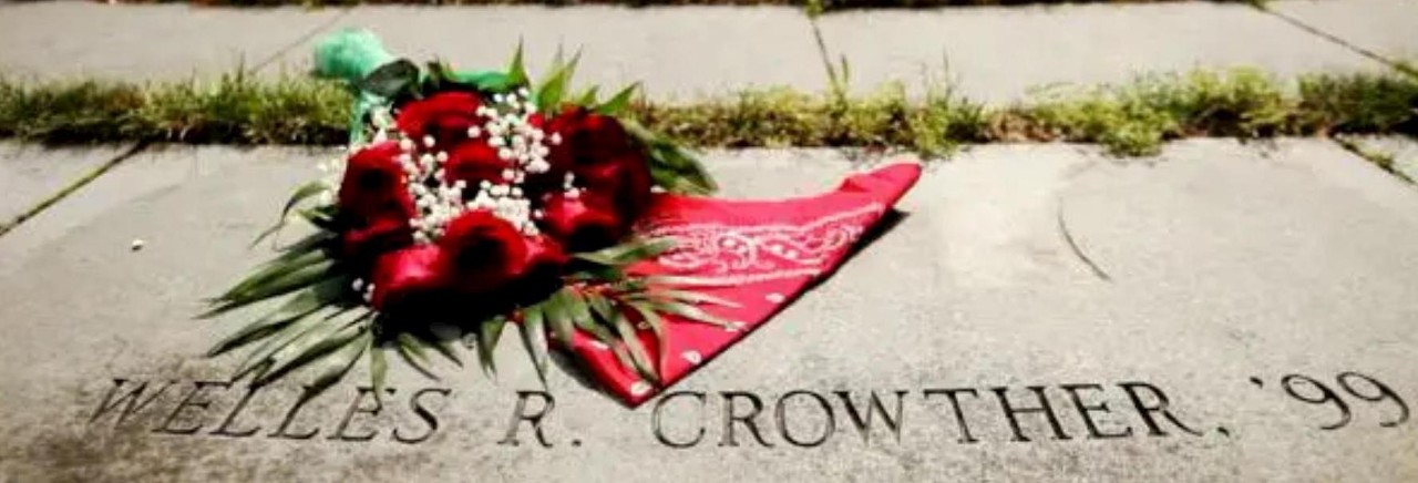 Photo of Photo of BC memorial labyrinth with red flowers and red bandanna near Welles R Crowther text