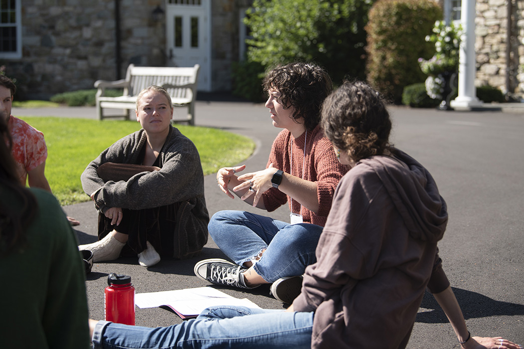 A group of students chat outside during the 2022 Social Work Summit