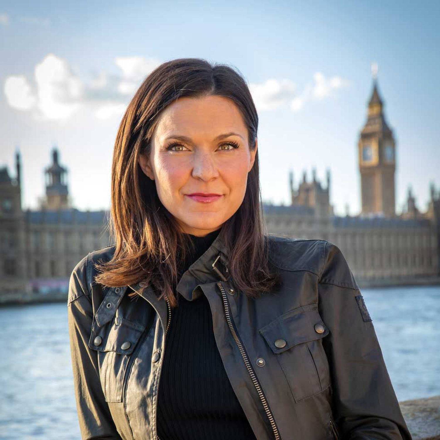 Maggie Rulli photographed in front of the Parliment buildings in London.