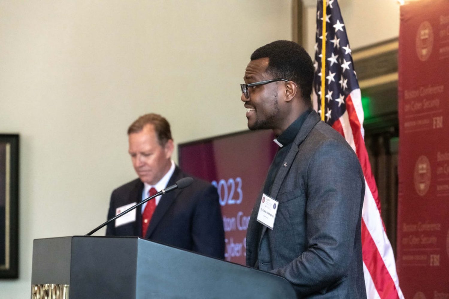 Collins Obidiagha, SJ, at the podium during the cybersecurity confereince