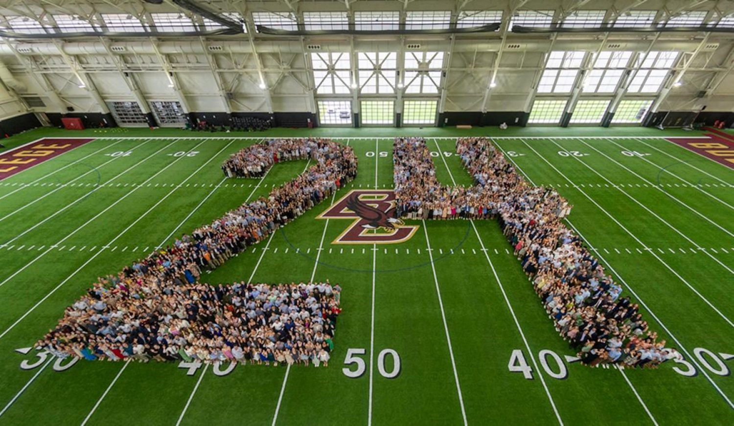 Members of the senior class pose in the shape of the number 24