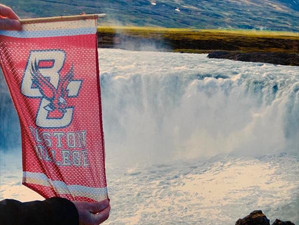 The BC banner in front of a waterfall
