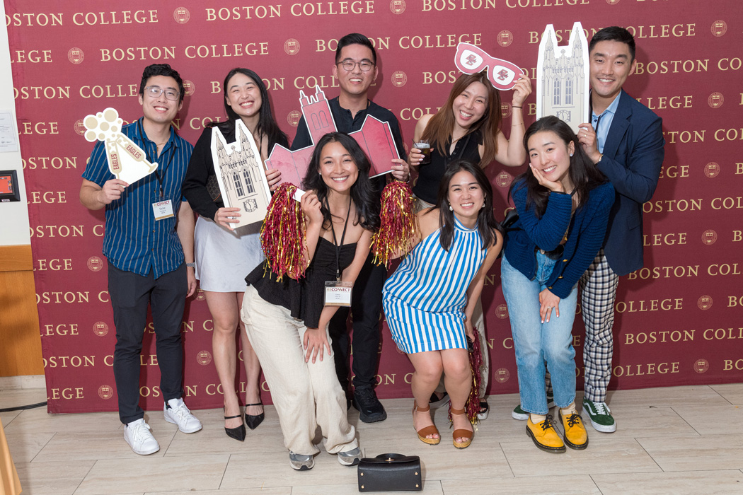 a group of attendees with Gasson Hall cutouts