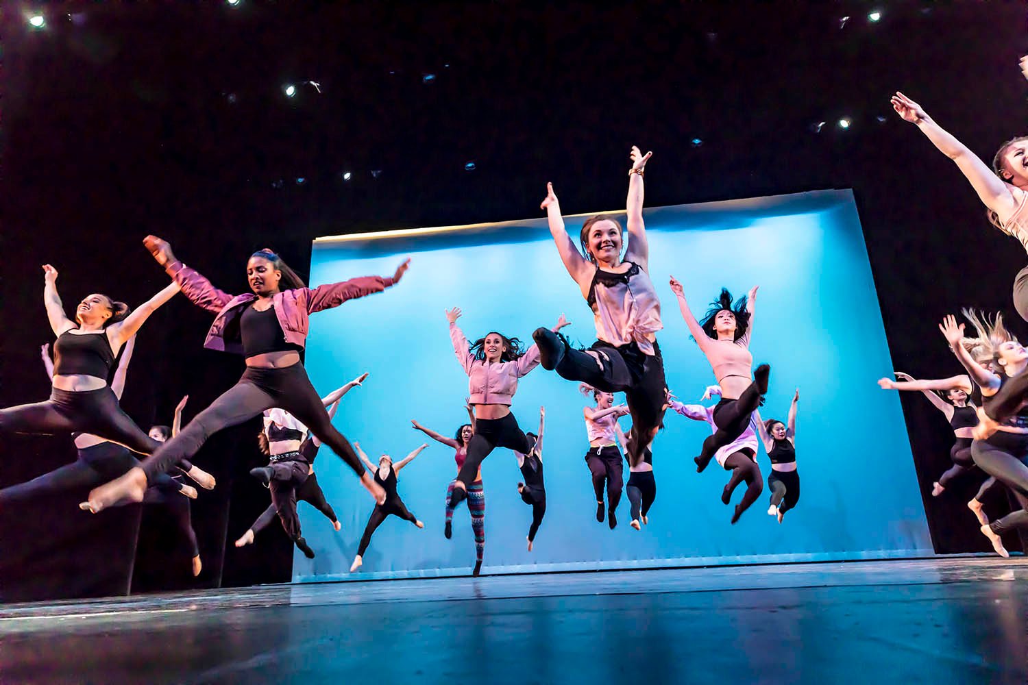 A group of students dancing on stage