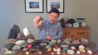 Prof. Ethan Baxter displays a rock in an educational video