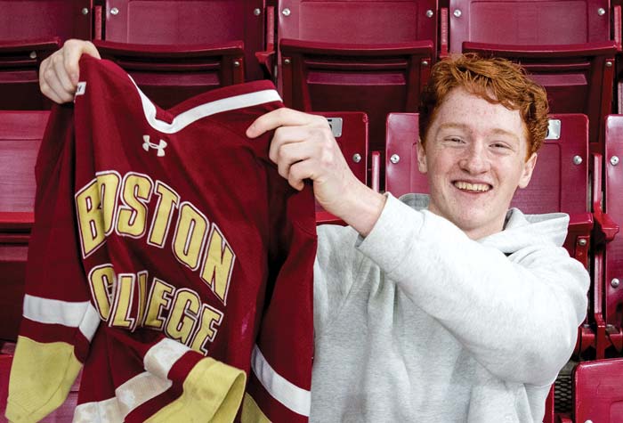 Danny Gillis with the BC hockey jersey from his youth with two photos of him at hockey games