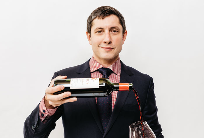 Master sommelier Brahm Callahan with a glass of red wine