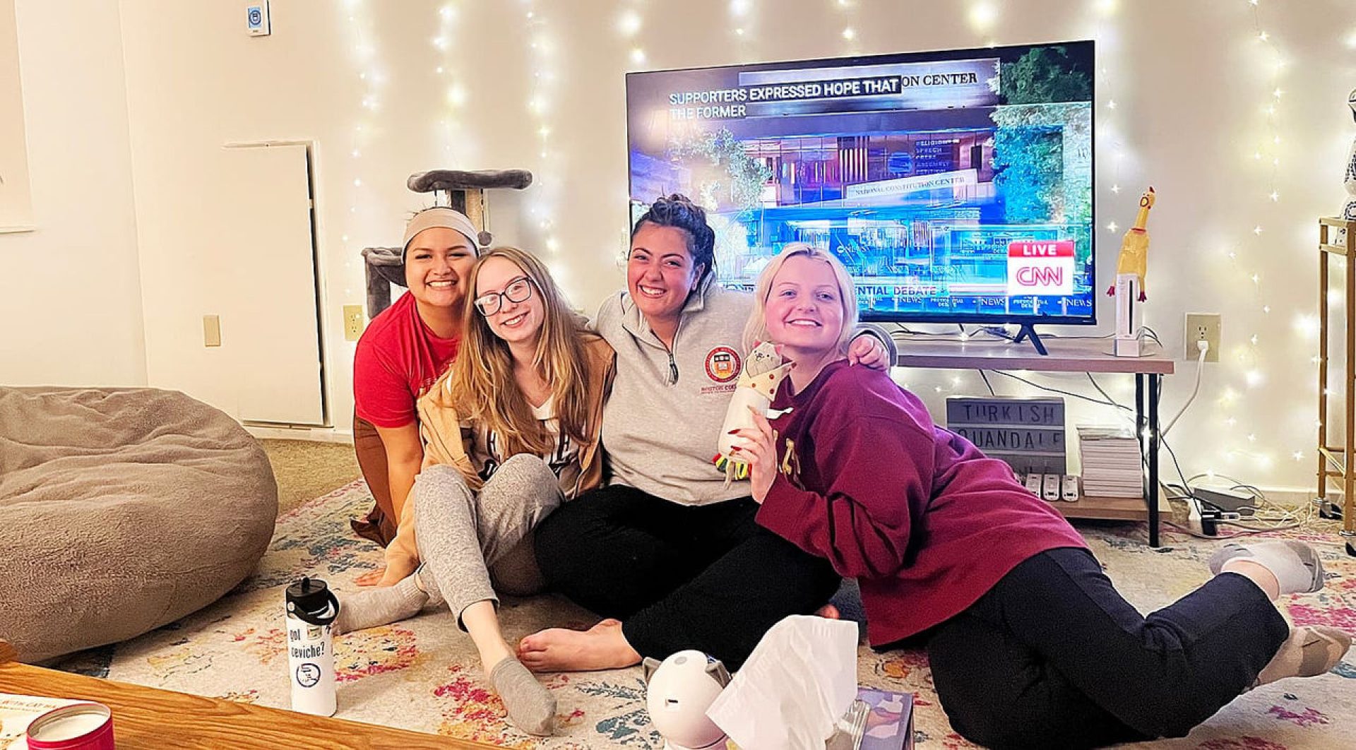 A group of students in front of a television