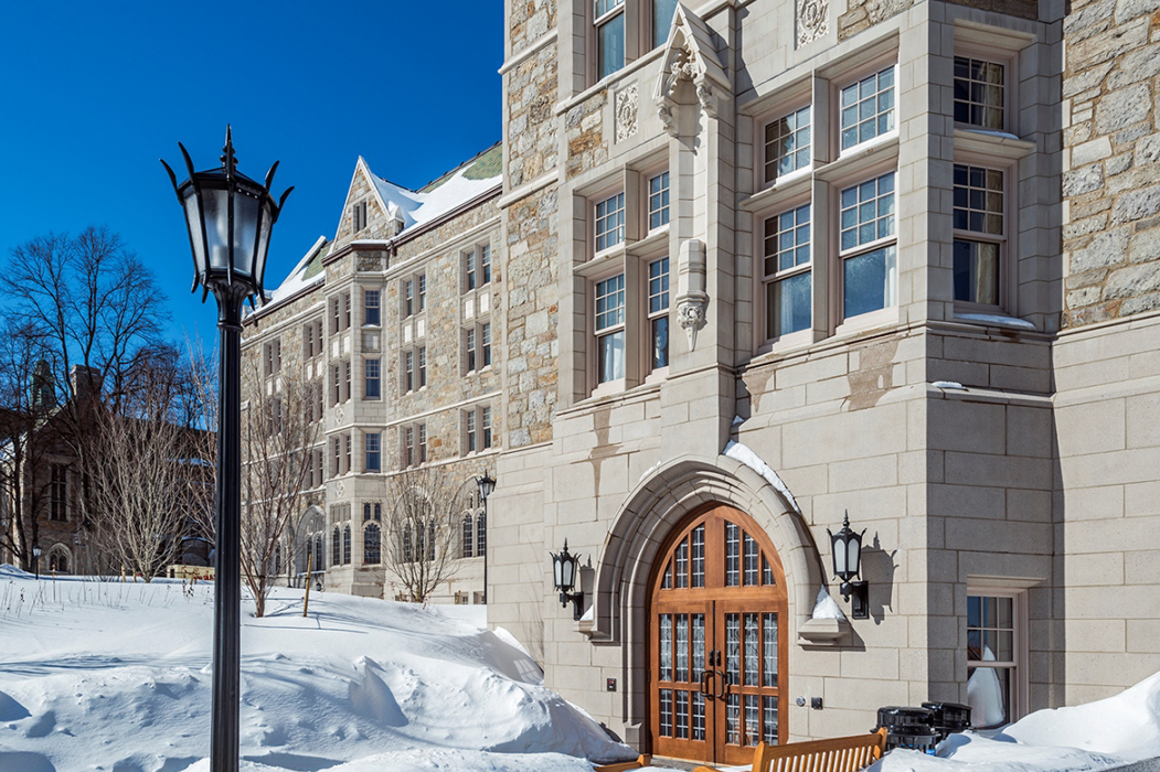 Exterior of the Woods College in winter