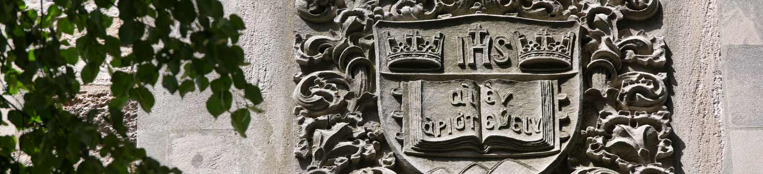 Sculptural relief of BC's shield on Bapst Library's exterior.